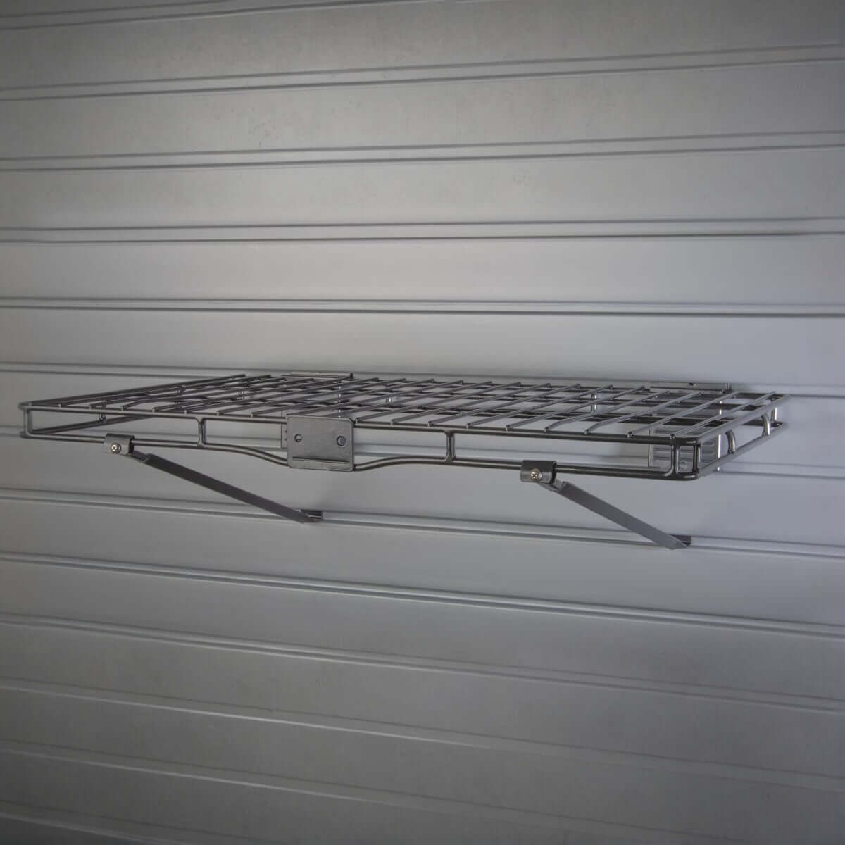 Slatwall Shelves 14x24 inch wire metal shelf mounted on gray slatwall panel with diagonal support brackets