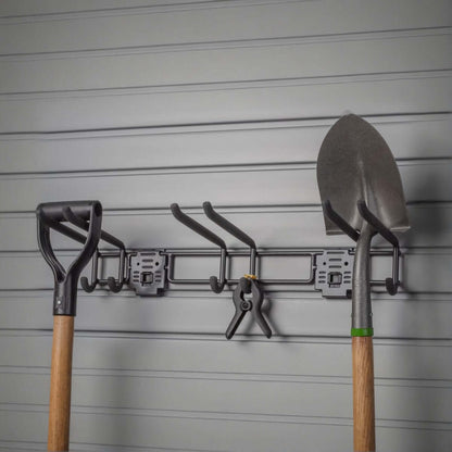 Slatwall hooks on a 24" tool bar organizing garden tools including shovels and pruners on a gray slatwall panel