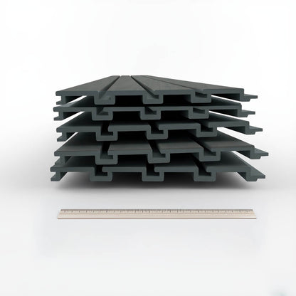 Slatwall Panels stacked in a bundle, driftwood gray finish, interlocking 12" wide boards shown beside a ruler for scale__DriftwoodSlate