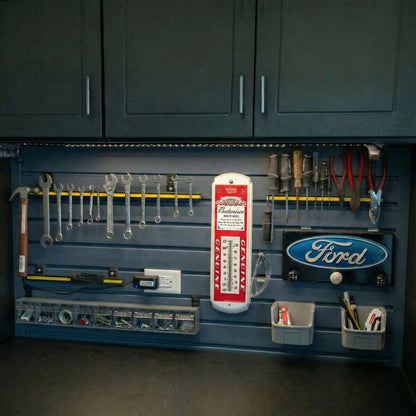 Slatwall Panels organizing a garage wall with wrenches, screwdrivers, Ford sign, Budweiser thermometer, and small parts bins__Graphite