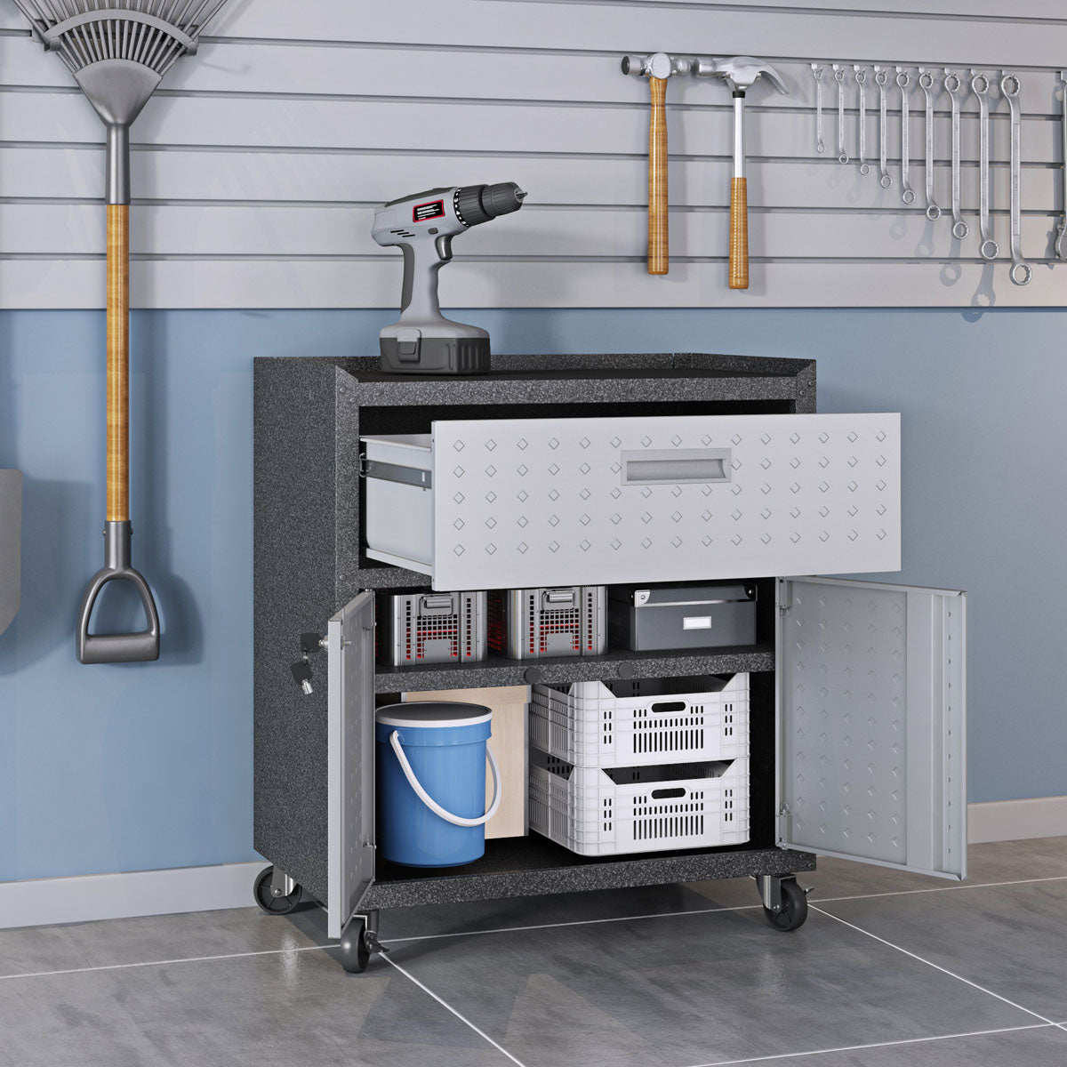 Garage Cabinet Sets with open drawer and doors revealing organized storage, casters, drill on top, tools on wall behind__DarkGray
