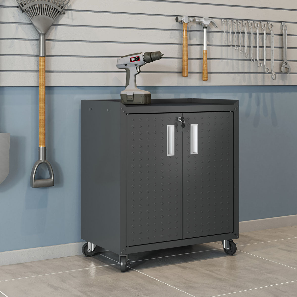 MidHeight Cabinet on wheels in dark gray with diamond-plate doors, drill on top, garage wall tools in background__CharcoalGray