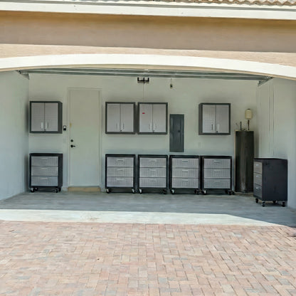 Garage Cabinet Sets with 5 rolling drawer units and 4 wall-mounted cabinets organize an open two-car garage