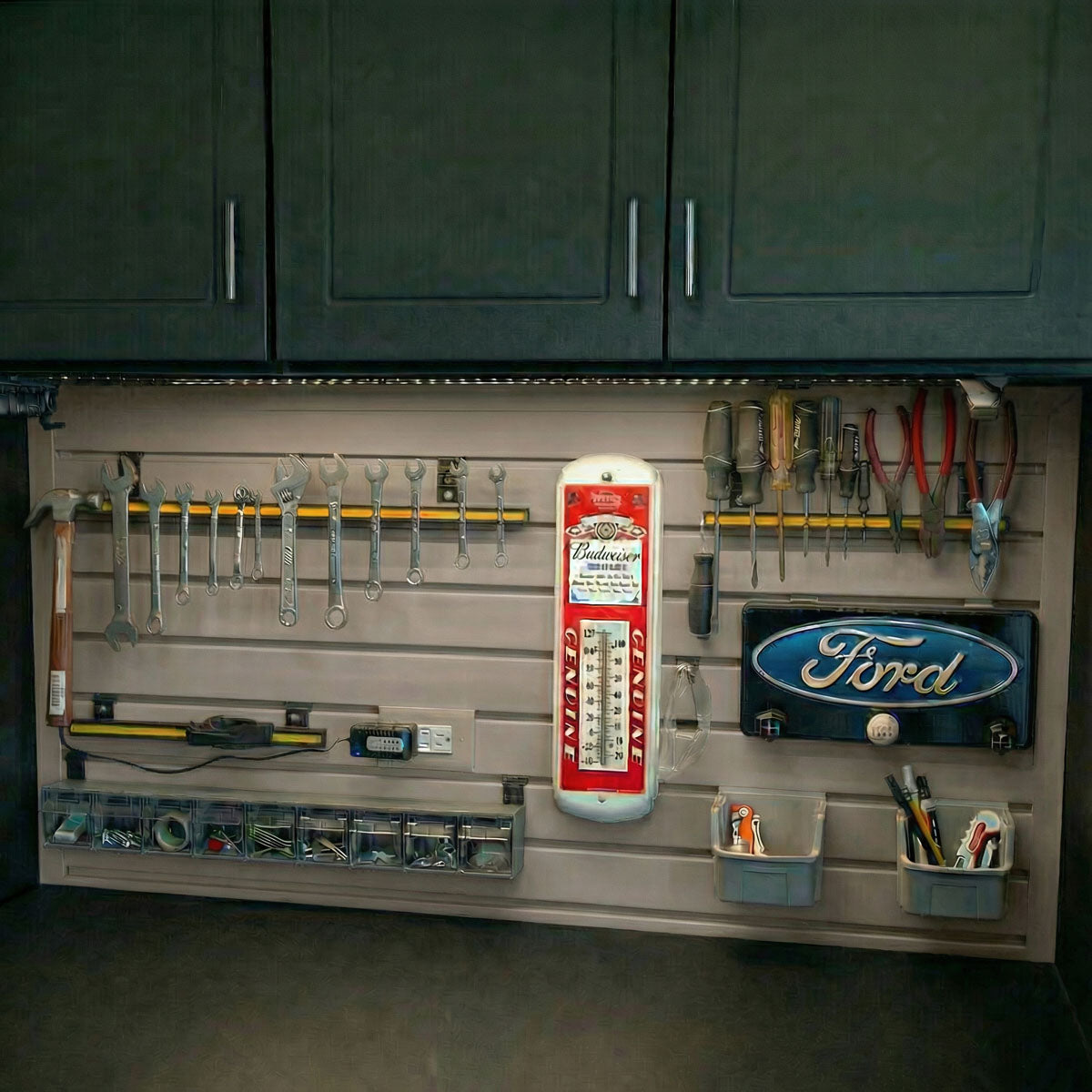 Slatwall Panels organizing a garage workshop with wrenches, screwdrivers, Ford sign, Budweiser thermometer, and small parts bins__Taupe