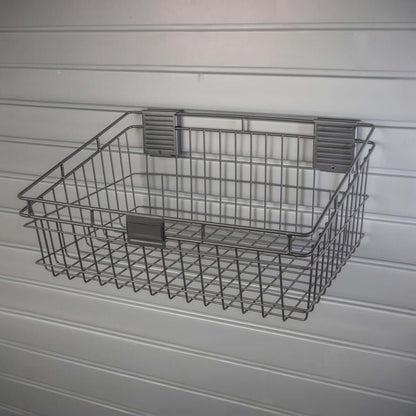 Slatwall Baskets - 12x18 inch silver wire basket mounted on white slatwall panel for garage storage organization