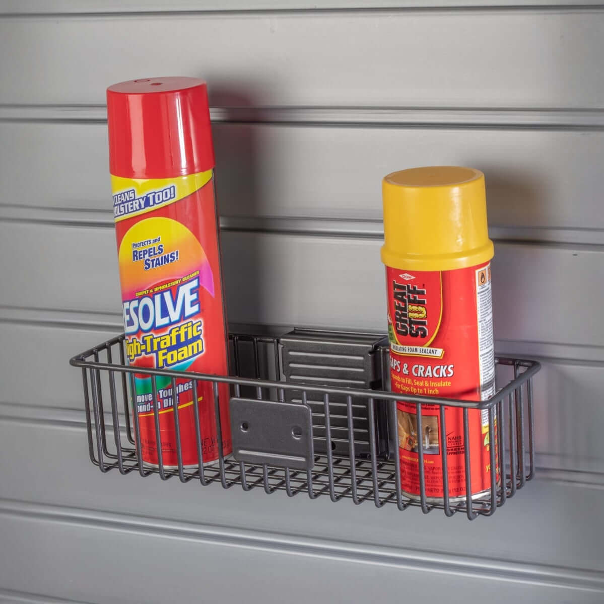 Slatwall Baskets holding Resolve foam spray and Great Stuff sealant mounted on gray garage wall panel
