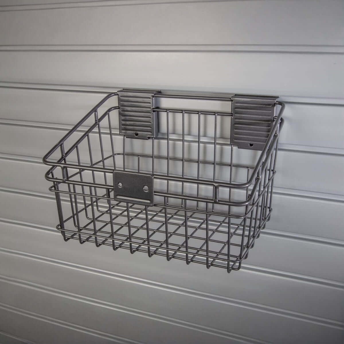 Slatwall Baskets wire storage basket mounted on gray slatwall panel, ideal for garage organization