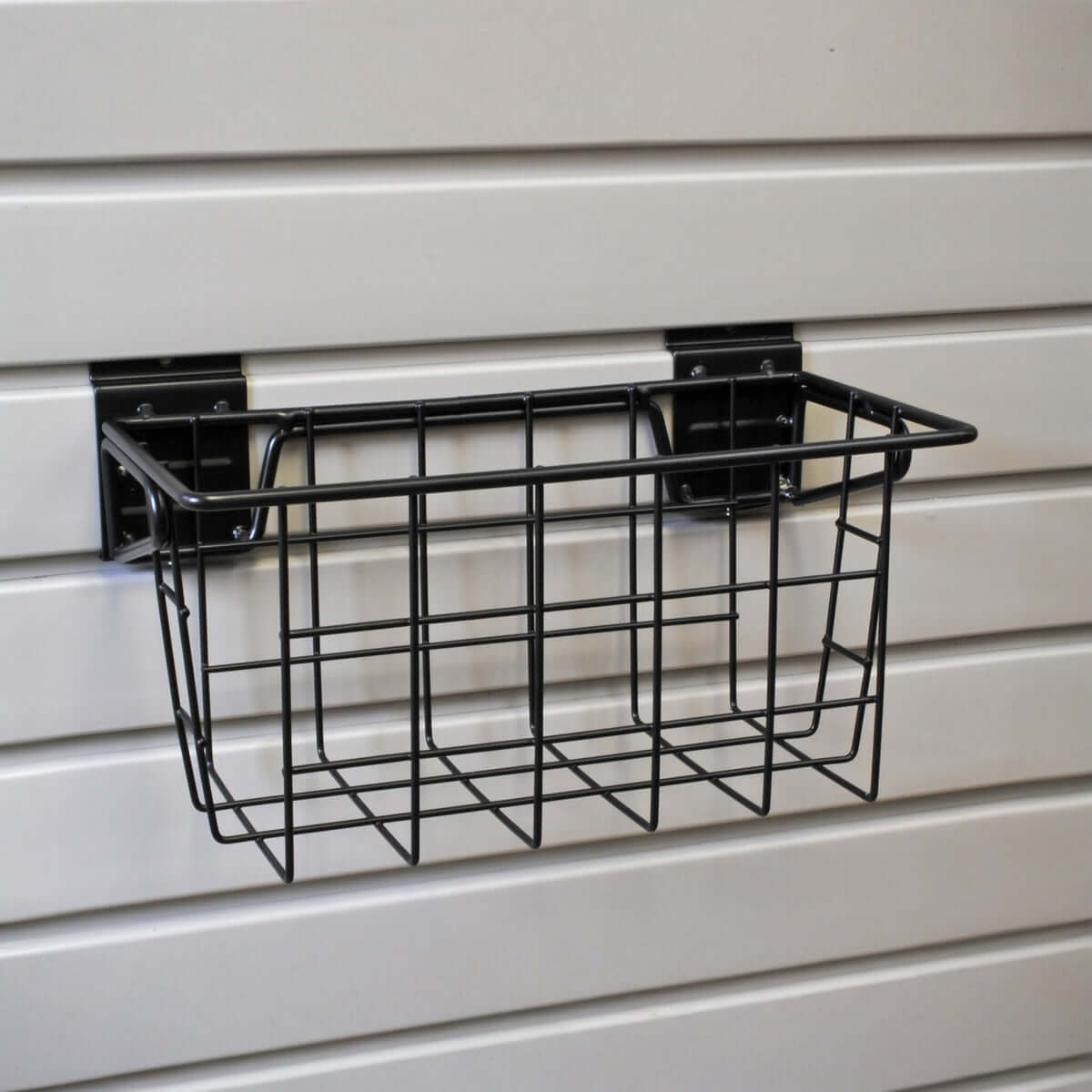 Slatwall Baskets - black wire narrow basket 12x6 mounted on gray slatwall panel for organized garage storage